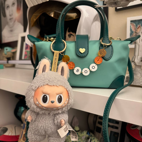 Friendship bracelet bag chain